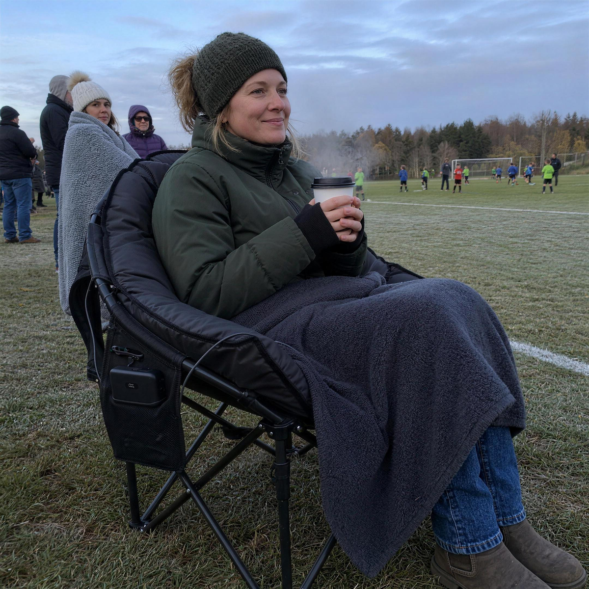 Mom staying warm on a frosty soccer sideline